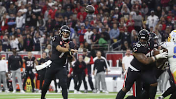 Jan 11, 2025; Houston, Texas, USA;  Houston Texans quarterback C.J. Stroud (7) throws an incomplete pass against the Los Angeles Chargers in the second quarter in an AFC wild card game at NRG Stadium. Mandatory Credit: Thomas Shea-Imagn Images