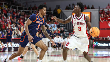 Nov 20, 2025; Queens, New York, USA;  St. John's basketball guard Joson Sanon (3) looks to drive past Bucknell Bison guard Josh Fulton (5) in the second half at Carnesecca Arena.