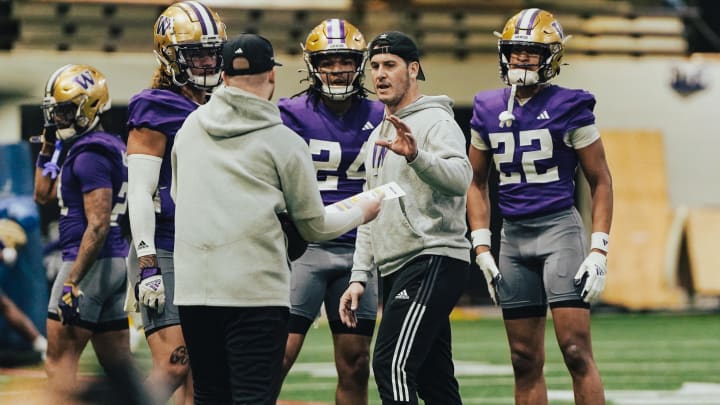 Vinnie Sunseri offers direction to his Husky safeties. 