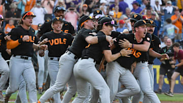 May 26 2024; Hoover, AL, USA; Tennessee players swarm relief pitcher Aaron Combs after he closed out the game with LSU at the Hoover Met to win the SEC Tournament championship game. Tennessee held on to win 4-3.