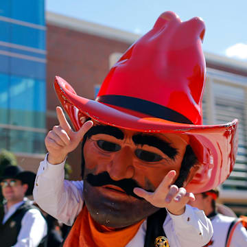 Oct 14, 2023; Stillwater, Oklahoma, USA; Oklahoma State Cowboys mascot Pistol Pete walks to Boone Pickens Stadium before a game between the Oklahoma State Cowboys and Kansas Jayhawks. Mandatory Credit: Nathan J. Fish-Imagn Images