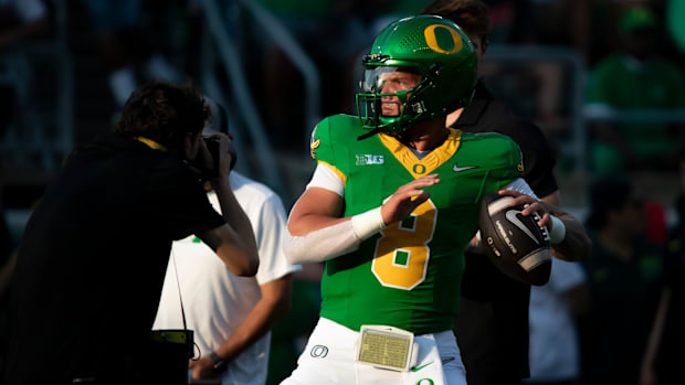 Oregon quarterback Dillon Gabriel throws out a pass during warm ups 