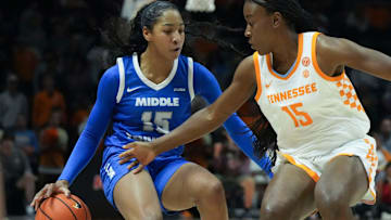 MTSU's Ta'Mia Scott (15) tries to keep the ball from Tennessee's Favor Ayodele (15) during an NCAA college basketball game on Tuesday, Nov. 12, 2024, in Knoxville, Tenn.