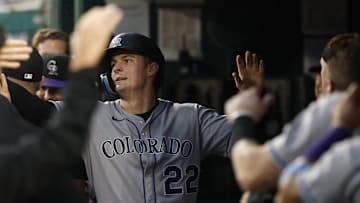 Jun 16, 2025; Washington, District of Columbia, USA; Colorado Rockies outfielder Mickey Moniak (22) celebrates with teammates in the dugout after scoring a run on an RBI single by Rockies first baseman Michael Toglia (not pictured) against the Washington Nationals during the fifth inning at Nationals Park. 