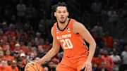 Mar 30, 2024; Boston, MA, USA; Illinois Fighting Illini forward Ty Rodgers (20) dribbles the ball against the Connecticut Huskies in the finals of the East Regional of the 2024 NCAA Tournament at TD Garden. Mandatory Credit: Brian Fluharty-Imagn Images