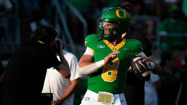 Oregon quarterback Dillon Gabriel throws out a pass during warm ups as the Oregon Ducks host the Boise State Broncos 