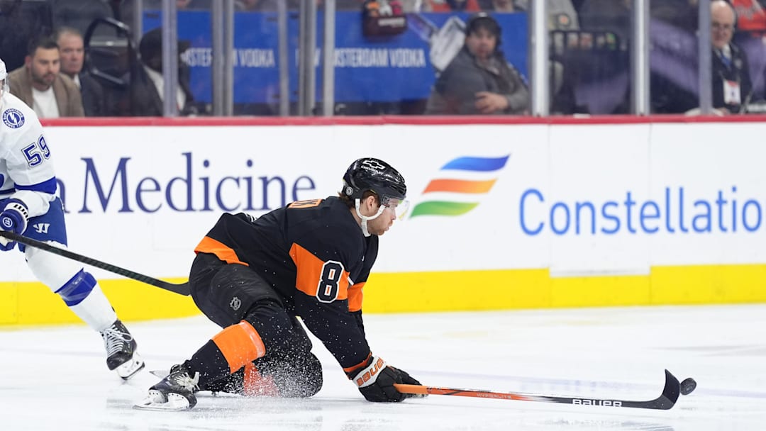 Mar 13, 2025; Philadelphia, Pennsylvania, USA; Philadelphia Flyers defenseman Cam York (8) defends a pass against the Tampa Bay Lightning in the first period at Wells Fargo Center.