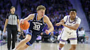 Feb 24, 2024; Manhattan, Kansas, USA; Brigham Young Cougars guard Dallin Hall (30) dribbles against Kansas State Wildcats guard Tylor Perry (2) during the second half at Bramlage Coliseum. Mandatory Credit: Scott Sewell-Imagn Images
