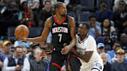 Nov 5, 2025; Memphis, Tennessee, USA; Houston Rockets forward Kevin Durant (7) handles the ball as Memphis Grizzlies forward Vince Williams Jr. (5) defends during the second quarter at FedExForum. Mandatory Credit: Petre Thomas-Imagn Images