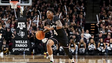 Feb 22, 2025; College Station, Texas, USA; Texas A&M Aggies guard Wade Taylor IV (4) dribbles the ball during the first half against the Tennessee Volunteers at Reed Arena. Mandatory Credit: Maria Lysaker-Imagn Images 
