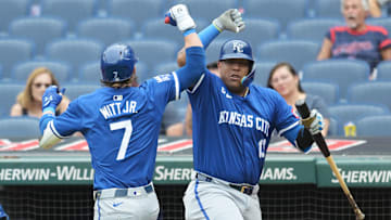 Aug 28, 2024; Cleveland, Ohio, USA; Kansas City Royals shortstop Bobby Witt Jr. (7) celebrates with designated hitter Salvador Perez (13) after hitting a home run during the third inning against the Cleveland Guardians at Progressive Field. Mandatory Credit: Ken Blaze-Imagn Images