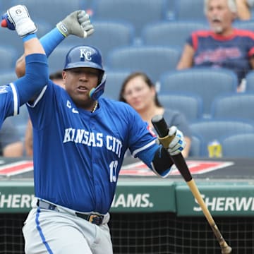 Aug 28, 2024; Cleveland, Ohio, USA; Kansas City Royals shortstop Bobby Witt Jr. (7) celebrates with designated hitter Salvador Perez (13) after hitting a home run during the third inning against the Cleveland Guardians at Progressive Field. Mandatory Credit: Ken Blaze-Imagn Images