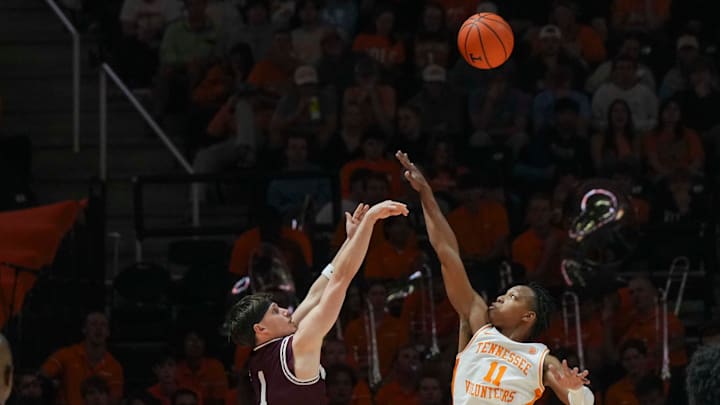 Tennessee guard Jordan Gainey (11) tries to block the shot by Montana guard Kai Johnson (1) during an NCAA basketball game between the Tennessee Volunteers and Montana Grizzlies at Thompson-Boling Arena at Food City Center on Wednesday, Nov. 13, 2024.