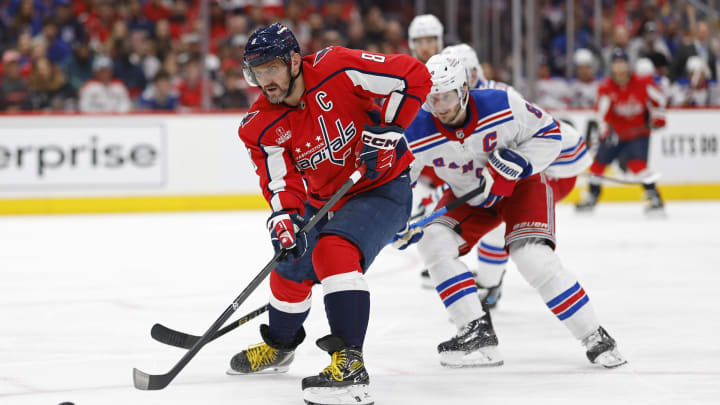 Apr 28, 2024; Washington, District of Columbia, USA; Washington Capitals left wing Alex Ovechkin (8) shoots the puck as New York Rangers defenseman Jacob Trouba (8) defends in the third period in game four of the first round of the 2024 Stanley Cup Playoffs at Capital One Arena. Mandatory Credit: Geoff Burke-USA TODAY Sports