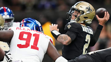Oct 5, 2025; New Orleans, Louisiana, USA; New Orleans Saints quarterback Spencer Rattler (2) passes the ball as New York Giants defensive tackle Darius Alexander (91) applies pressure during the first quarter at Caesars Superdome. Mandatory Credit: Matthew Hinton-Imagn Images