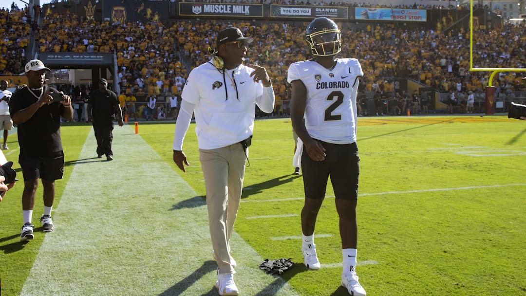 The elder Sanders (left) coached his son Shedeur (right) for two seasons with the Colorado Buffaloes. 