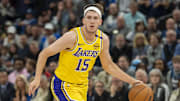 Apr 25, 2025; Minneapolis, Minnesota, USA; Los Angeles Lakers guard Austin Reaves (15) dribbles the ball against the Minnesota Timberwolves during game three of first round for the 2024 NBA Playoffs at Target Center. Mandatory Credit: Jesse Johnson-Imagn Images
