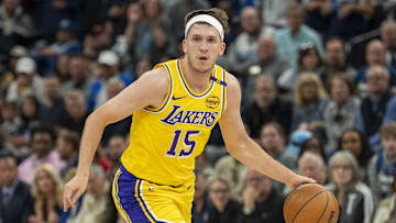 Apr 25, 2025; Minneapolis, Minnesota, USA; Los Angeles Lakers guard Austin Reaves (15) dribbles the ball against the Minnesota Timberwolves during game three of first round for the 2024 NBA Playoffs at Target Center. Mandatory Credit: Jesse Johnson-Imagn Images