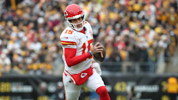 Dec 25, 2024; Pittsburgh, Pennsylvania, USA;  Kansas City Chiefs quarterback Patrick Mahomes (15) runs with the ball against the Pittsburgh Steelers during the first quarter at Acrisure Stadium. Mandatory Credit: Charles LeClaire-Imagn Images