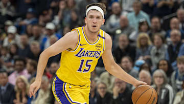 Los Angeles Lakers guard Austin Reaves dribbles the ball against the Minnesota Timberwolves during the 2024 NBA Playoffs.