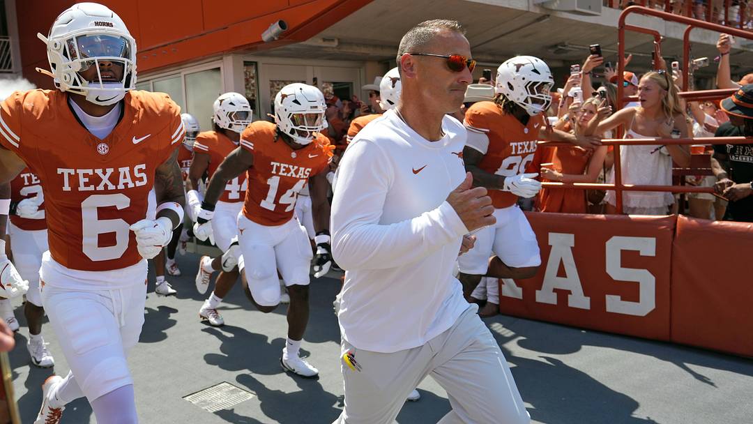 Texas Longhorns Head Coach Steve Sarkisian leads his team on to the field before a game against the Texas State Bobcats at Darrell K Royal-Texas Memorial Stadium