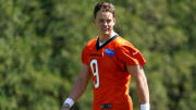 Cincinnati Bengals quarterback Joe Burrow (9) smiles during practice, Tuesday, May 17, 2022, at the Paul Brown Stadium practice fields in Cincinnati.

Cincinnati Bengals Practice May 17 0095