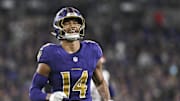 Nov 7, 2024; Baltimore, Maryland, USA; Baltimore Ravens safety Kyle Hamilton (14) reacts after tips a Cincinnati Bengals quarterback Joe Burrow (9) pass during the first quarter  at M&T Bank Stadium. Mandatory Credit: Tommy Gilligan-Imagn Images