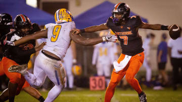 Newberry Panthers Mykah Newton (9) tries to sack \h7u\ in the first half. The Hawthorne Hornets hosted the Newberry Panthers at Hawthorne High School in Hawthorne, FL on Friday, November 17, 2023 in the Class 1R-Region 4 Semifinals. Hawthorne lead 21-0 at the half. [Doug Engle/Ocala Star Banner]