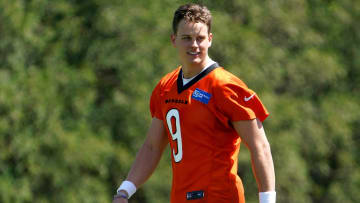 Cincinnati Bengals quarterback Joe Burrow (9) smiles during practice, Tuesday, May 17, 2022, at the Paul Brown Stadium practice fields in Cincinnati.

Cincinnati Bengals Practice May 17 0095