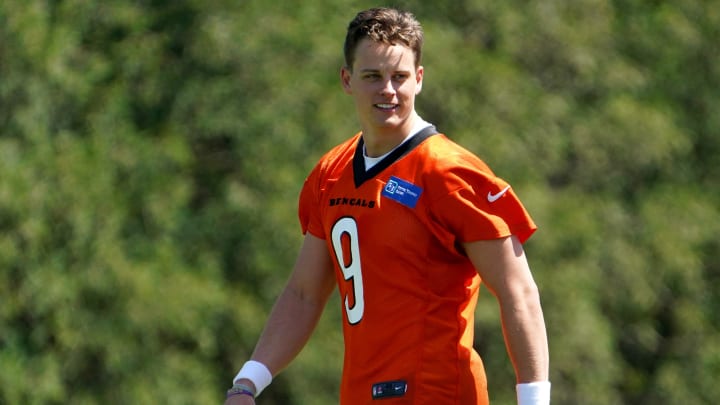 Cincinnati Bengals quarterback Joe Burrow (9) smiles during practice, Tuesday, May 17, 2022, at the Paul Brown Stadium practice fields in Cincinnati.

Cincinnati Bengals Practice May 17 0095