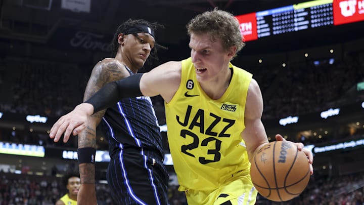 Jan 13, 2023; Salt Lake City, Utah, USA; Utah Jazz forward Lauri Markkanen (23) drives with the ball against Orlando Magic forward Paolo Banchero (5) in the third quarter at Vivint Arena. Mandatory Credit: Rob Gray-Imagn Images
