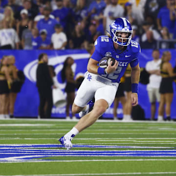 Aug 31, 2024; Lexington, Kentucky, USA; Kentucky Wildcats quarterback Brock Vandagriff (12) runs out of the pocket against Southern Miss Golden Eagles at Kroger Field. Mandatory Credit: Carter Skaggs-Imagn Images