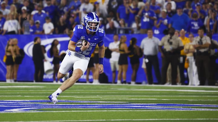 Aug 31, 2024; Lexington, Kentucky, USA; Kentucky Wildcats quarterback Brock Vandagriff (12) runs out of the pocket against Southern Miss Golden Eagles at Kroger Field. Mandatory Credit: Carter Skaggs-Imagn Images