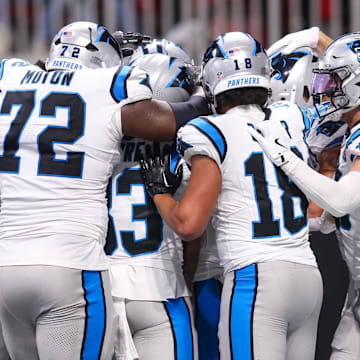 Jan 5, 2025; Atlanta, Georgia, USA; Carolina Panthers players celebrate after an overtime victory against the Atlanta Falcons at Mercedes-Benz Stadium. Mandatory Credit: Brett Davis-Imagn Images