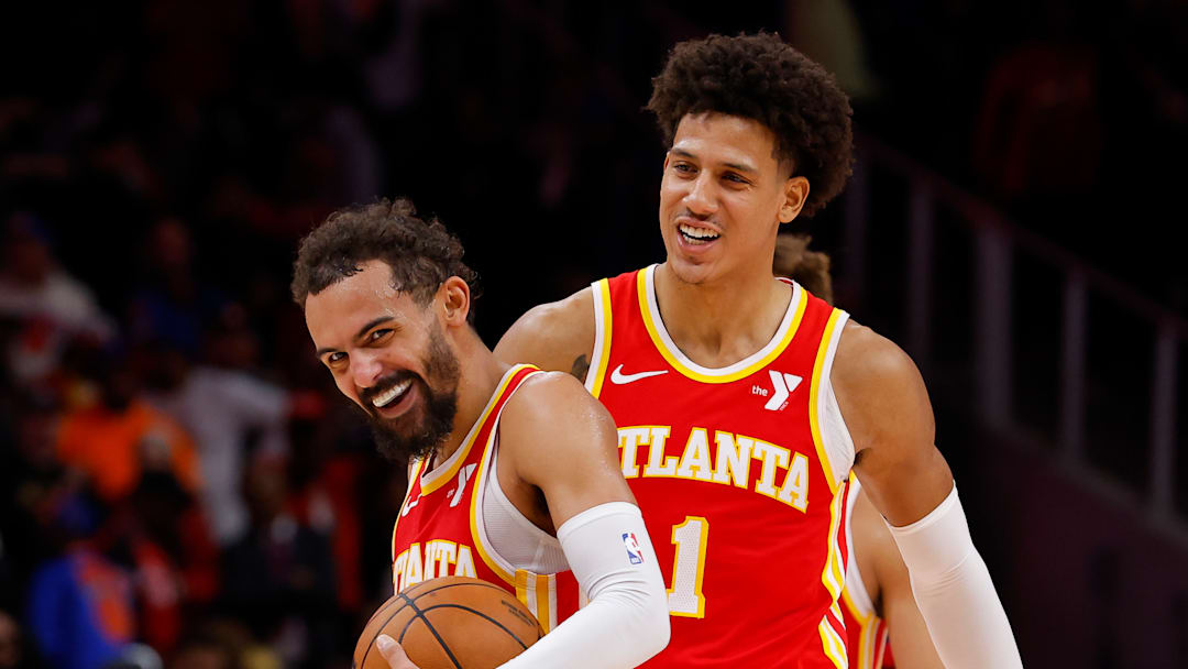 Trae Young and Jalen Johnson laughing during a game