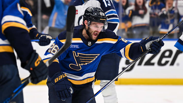 May 2, 2025; St. Louis, Missouri, USA; St. Louis Blues left wing Nathan Walker (26) reacts after scoring a goal against the Winnipeg Jets during the second period in game six of the first round of the 2025 Stanley Cup Playoffs at Enterprise Center. Mandatory Credit: Connor Hamilton-Imagn Images