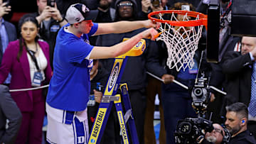 Mar 29, 2025; Newark, NJ, USA; Duke Blue Devils forward Cooper Flagg (2) cuts down the net after the Duke Blue Devils beat the Alabama Crimson Tide in the East Regional final of the 2025 NCAA tournament at Prudential Center. Mandatory Credit: Vincent Carchietta-Imagn Images