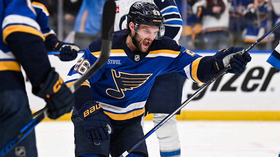 May 2, 2025; St. Louis, Missouri, USA; St. Louis Blues left wing Nathan Walker (26) reacts after scoring a goal against the Winnipeg Jets during the second period in game six of the first round of the 2025 Stanley Cup Playoffs at Enterprise Center. Mandatory Credit: Connor Hamilton-Imagn Images