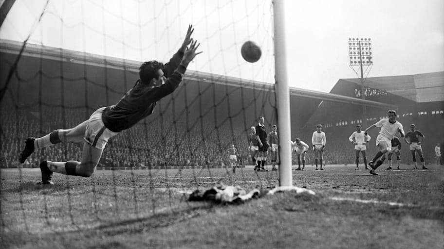 Liverpool's Tommy Lawrence saves a penalty kick at Anfield in 1964.