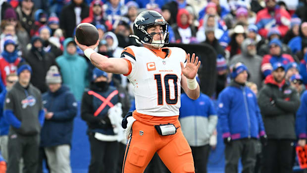 Jan 12, 2025; Orchard Park, New York, USA; Denver Broncos quarterback Bo Nix (10) throws downfield during the fourth quarter