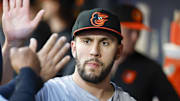 Jul 2, 2024; Seattle, Washington, USA; Baltimore Orioles starting pitcher Grayson Rodriguez (30) high-fives teammates in the dugout after being relieved for against the Seattle Mariners during the seventh inning at T-Mobile Park. Mandatory Credit: Joe Nicholson-Imagn Images