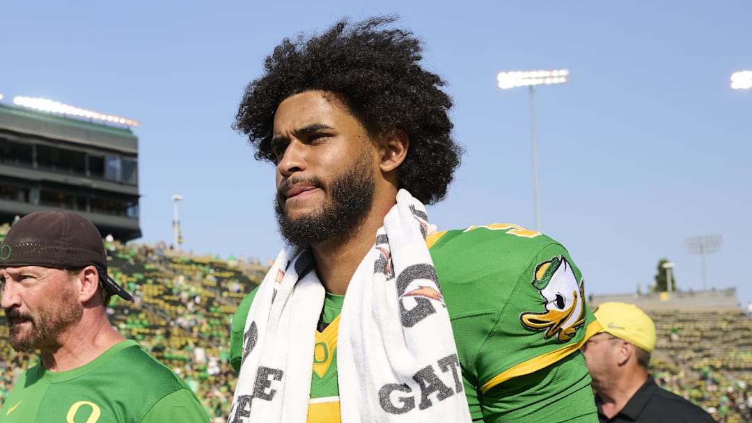 Sep 6, 2025; Eugene, Oregon, USA; Oregon Ducks quarterback Dante Moore (5) walks off the field after a game against the Oklahoma State Cowboys at Autzen Stadium. Mandatory Credit: Troy Wayrynen-Imagn Images
