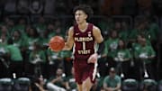 Jan 17, 2024; Coral Gables, Florida, USA; Florida State Seminoles guard Jalen Warley (1) dribbles the basketball against the Miami Hurricanes during the first half at Watsco Center. Mandatory Credit: Sam Navarro-Imagn Images