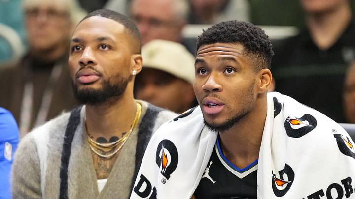 Nov 12, 2024; Milwaukee, Wisconsin, USA;  Milwaukee Bucks forward Giannis Antetokounmpo (34) sits with guard Damian Lillard on the bench during the fourth quarter against the Toronto Raptors at Fiserv Forum. Mandatory Credit: Jeff Hanisch-Imagn Images