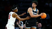 Mar 20, 2025; Wichita, KS, USA; Texas Tech Red Raiders forward JT Toppin (15) defends North Carolina-Wilmington Seahawks forward Harlan Obioha (55) in the first half of a first round men’s NCAA Tournament game at Intrust Bank Arena. Mandatory Credit: Nick Tre. Smith-Imagn Images