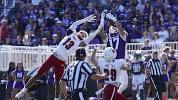 Aug 31, 2024; Evanston, Illinois, USA; Miami (Oh) Redhawks defensive back Raion Strader (13) breaks up a pass to Northwestern Wildcats wide receiver Bryce Kirtz (17) during the first half at Lanny and Sharon Martin Stadium. Mandatory Credit: David Banks-Imagn Images