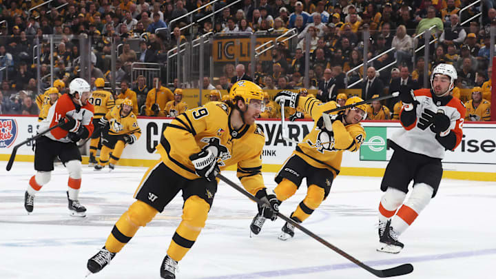 Apr 27, 2026; Pittsburgh, Pennsylvania, USA;  Pittsburgh Penguins center Connor Dewar (19) skates with the puck against the Philadelphia Flyers during the first period in game five of the first round of the 2026 Stanley Cup Playoffs at PPG Paints Arena. Mandatory Credit: Charles LeClaire-Imagn Images