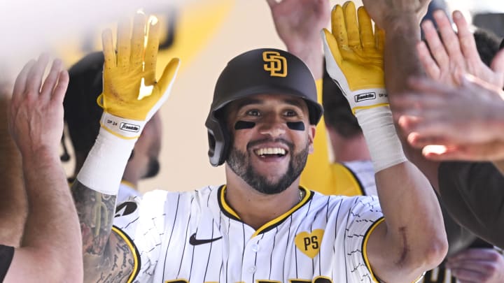 August 14, 2024; San Diego, California, USA; San Diego Padres outfielder David Peralta (24) celebrates with teammates after hitting a two run home run against the Pittsburgh Pirates during the third inning at Petco Park. Mandatory Credit: Denis Poroy-USA TODAY Sports at Petco Park. 