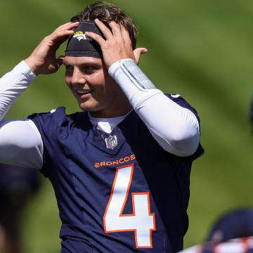 May 23, 2024; Englewood, CO, USA; Denver Broncos quarterback Zach Wilson (4) during organized team activities at Centura Health Training Center. Mandatory Credit: Isaiah J. Downing-USA TODAY Sports