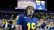 Michigan quarterback Bryce Underwood (19) walks off the field after leading the Wolverines to a 34-17 win over New Mexico in his collegiate debut Saturday. 